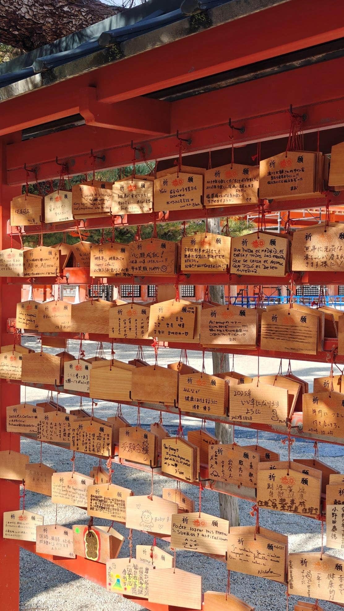 Wooden prayer plaques hanging on a shrine rack