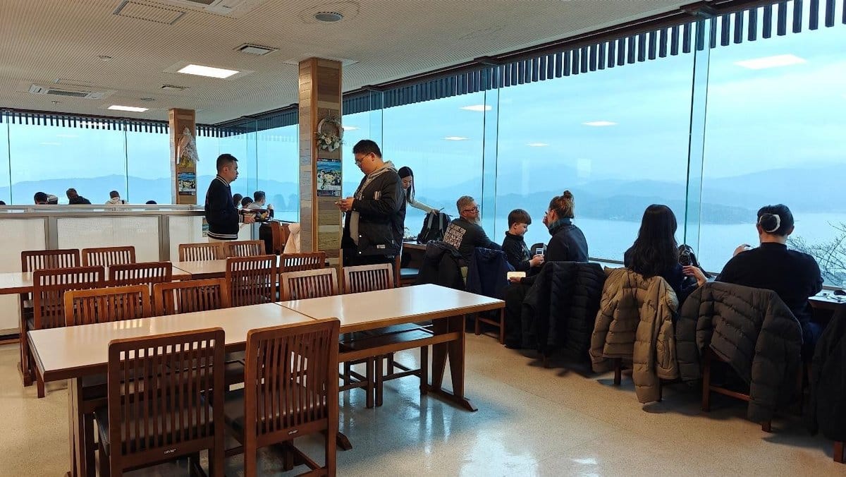 Cafe with large windows overlooking scenic mountain view