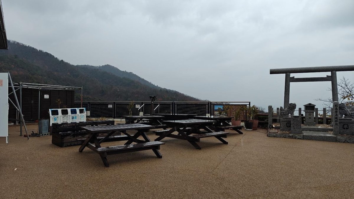 Empty picnic area with mountain view and Torii gate