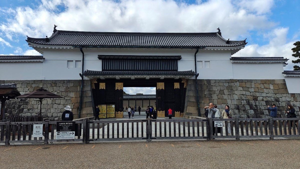 Historic gate with visitors outside