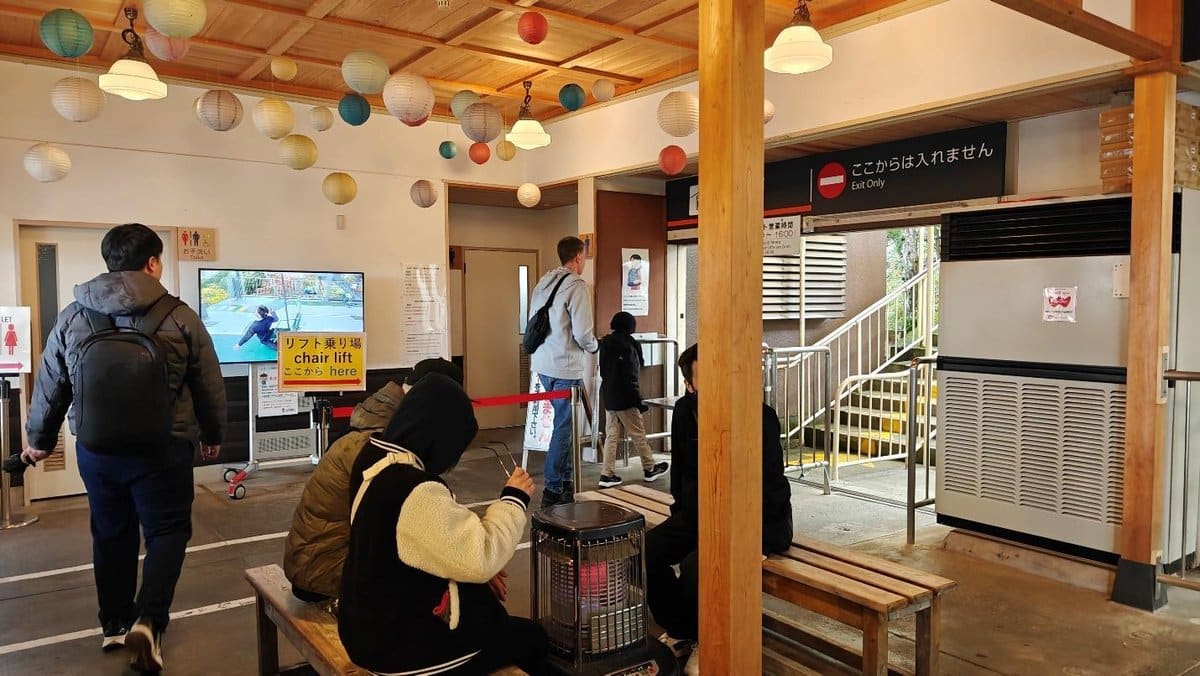 Indoor chair lift entrance with colorful hanging lanterns