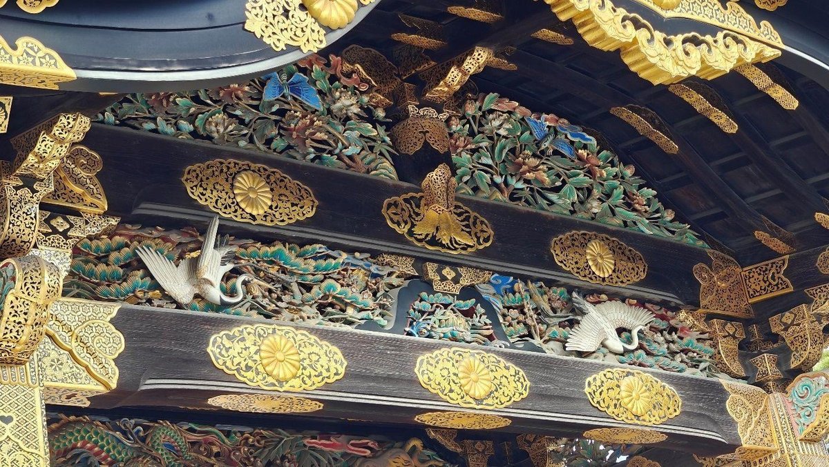 Intricate gold and wood temple carvings