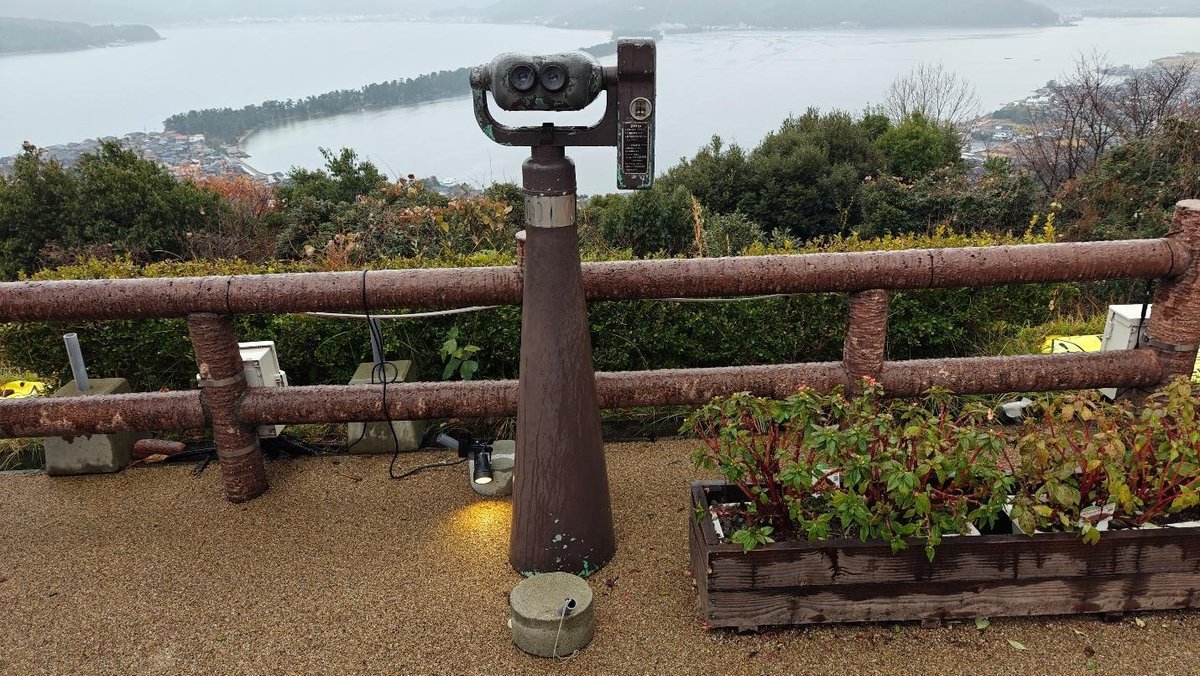 Overlook with binoculars and scenic coastal view