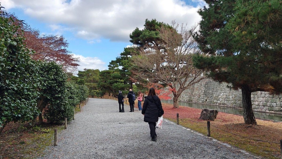 People walking in a scenic park pathway