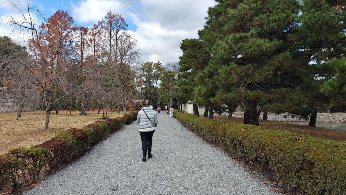 People walking through park pathway