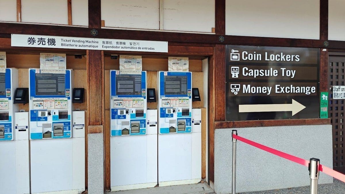 Ticket machines next to signage