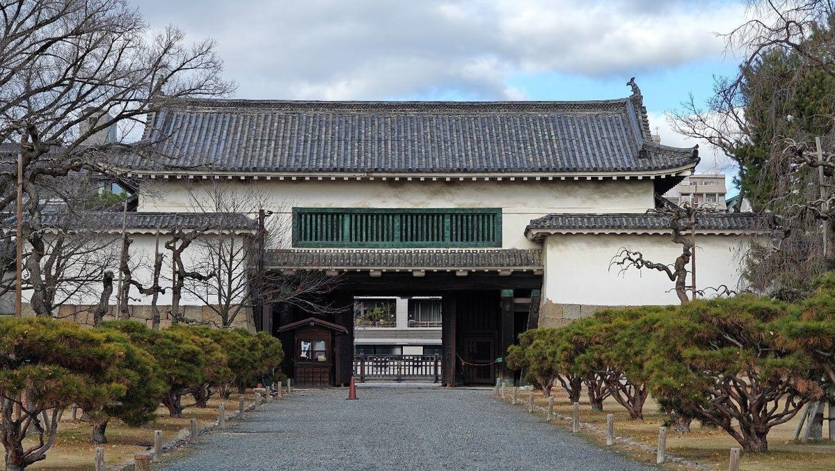 Traditional Japanese gate and trees