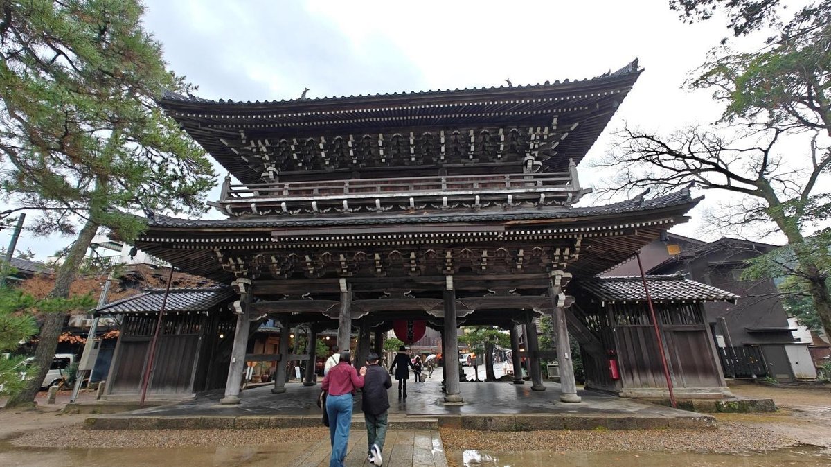 Traditional Japanese temple gate surrounded by trees