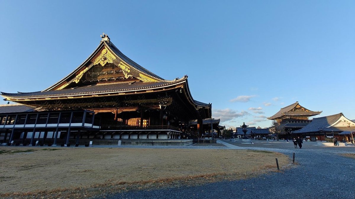 Traditional Japanese temple under clear blue sky
