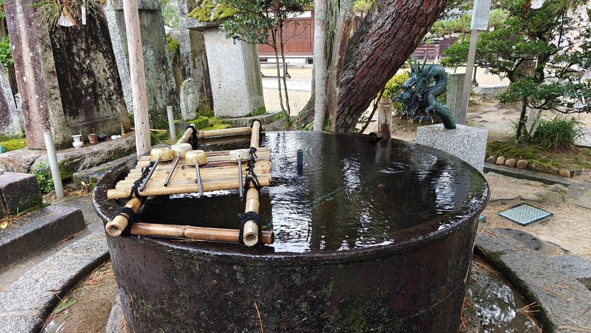 Traditional Japanese water basin with bamboo ladles