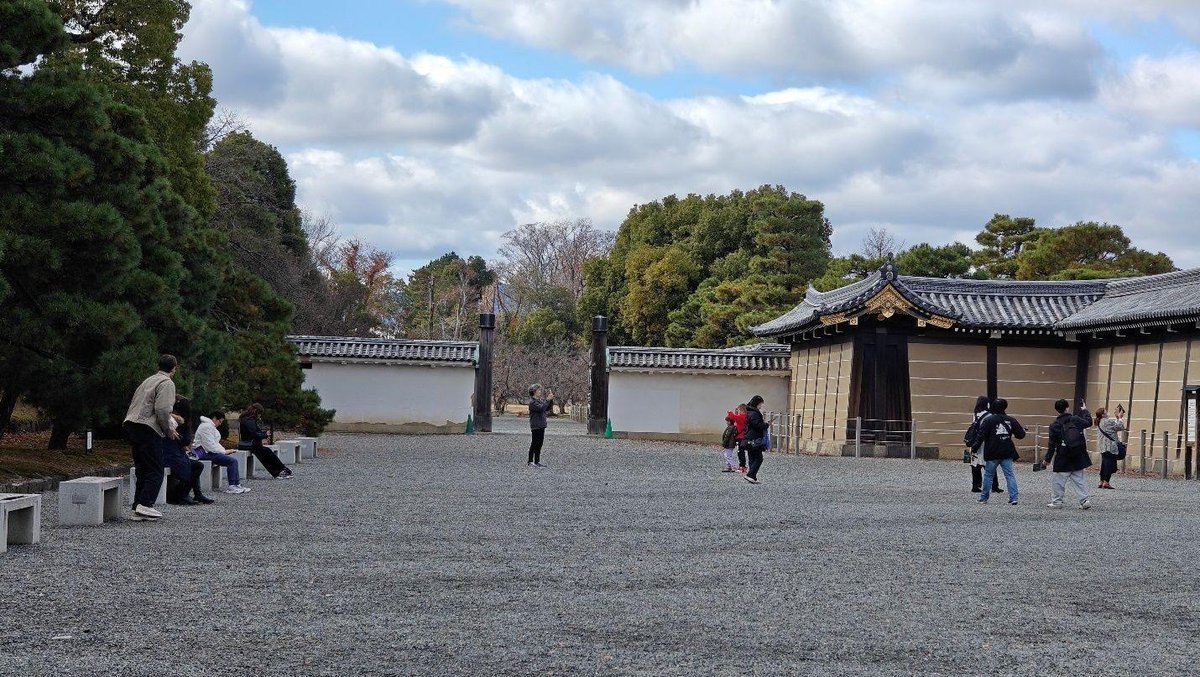 Visitors explore a historic courtyard