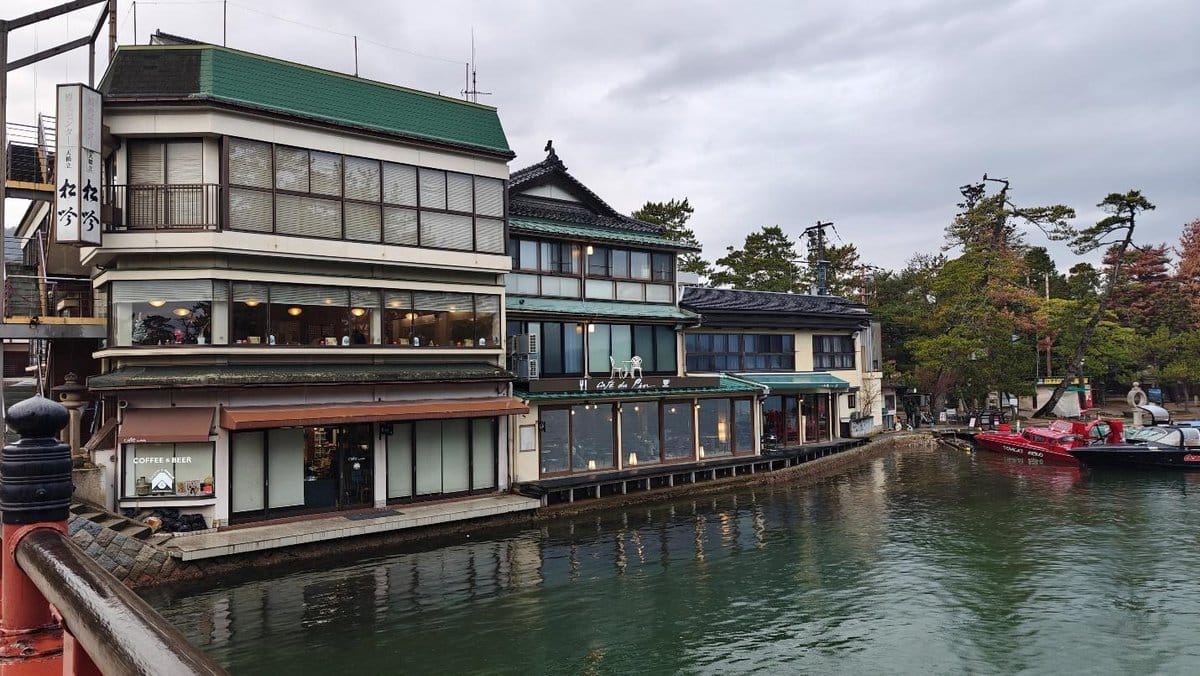 Waterfront building with traditional architecture and boats