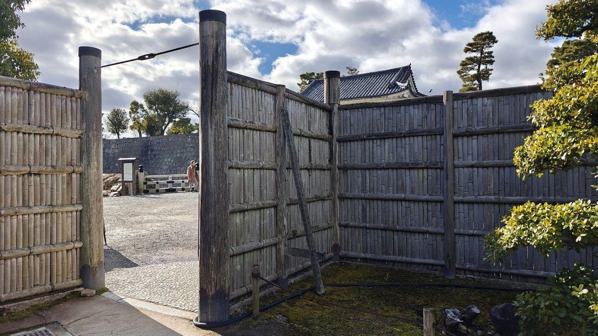 Wooden gate with cloudy sky