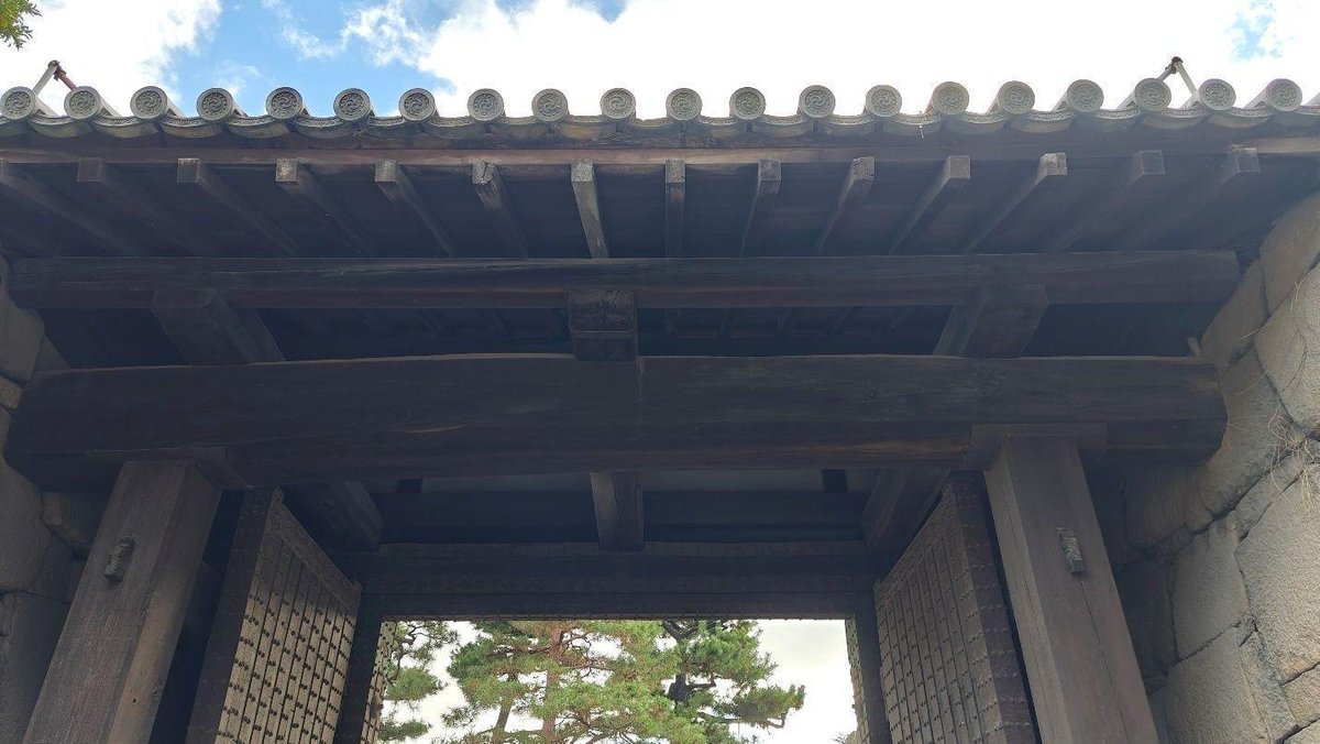 Wooden gate with intricate tiled roof