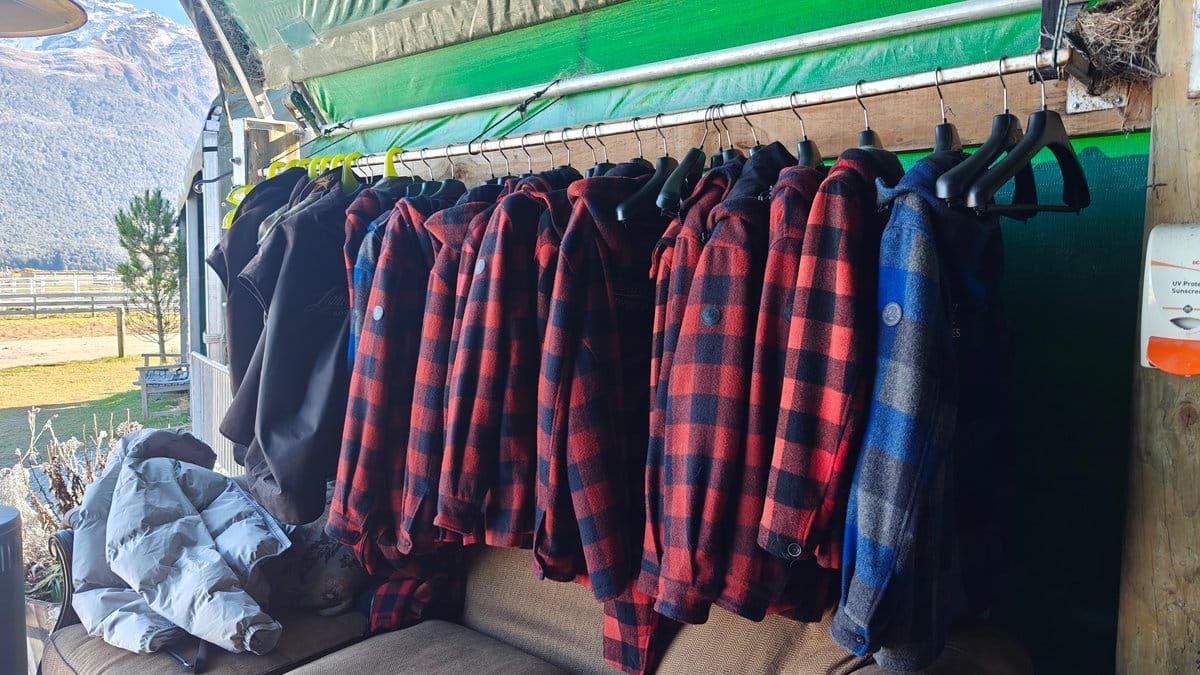 A rack of red-and-black plaid flannel shirts and