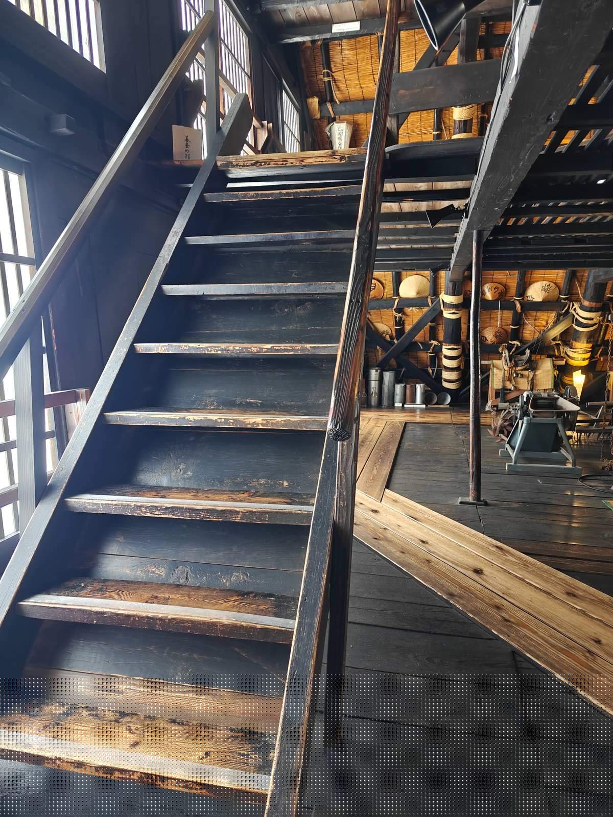 A wooden staircase on the silkworm floor leading