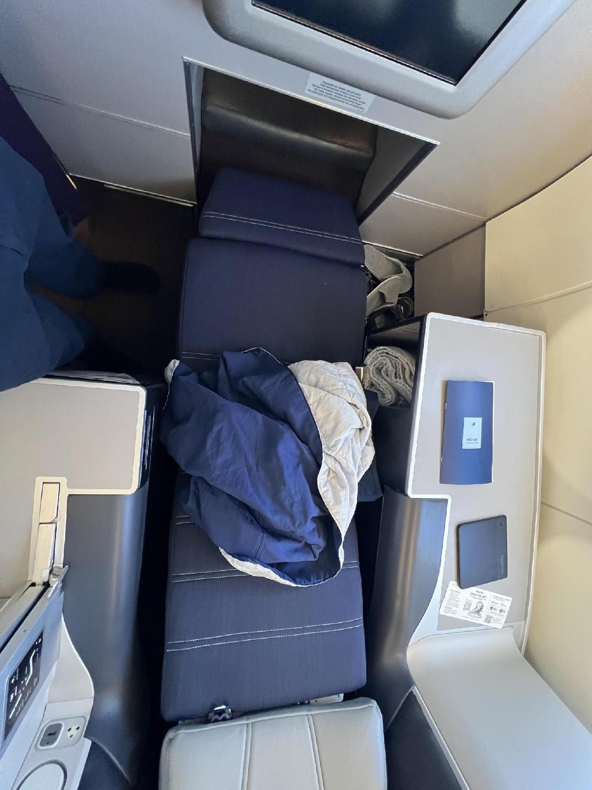 Airplane seat with bedding and screen