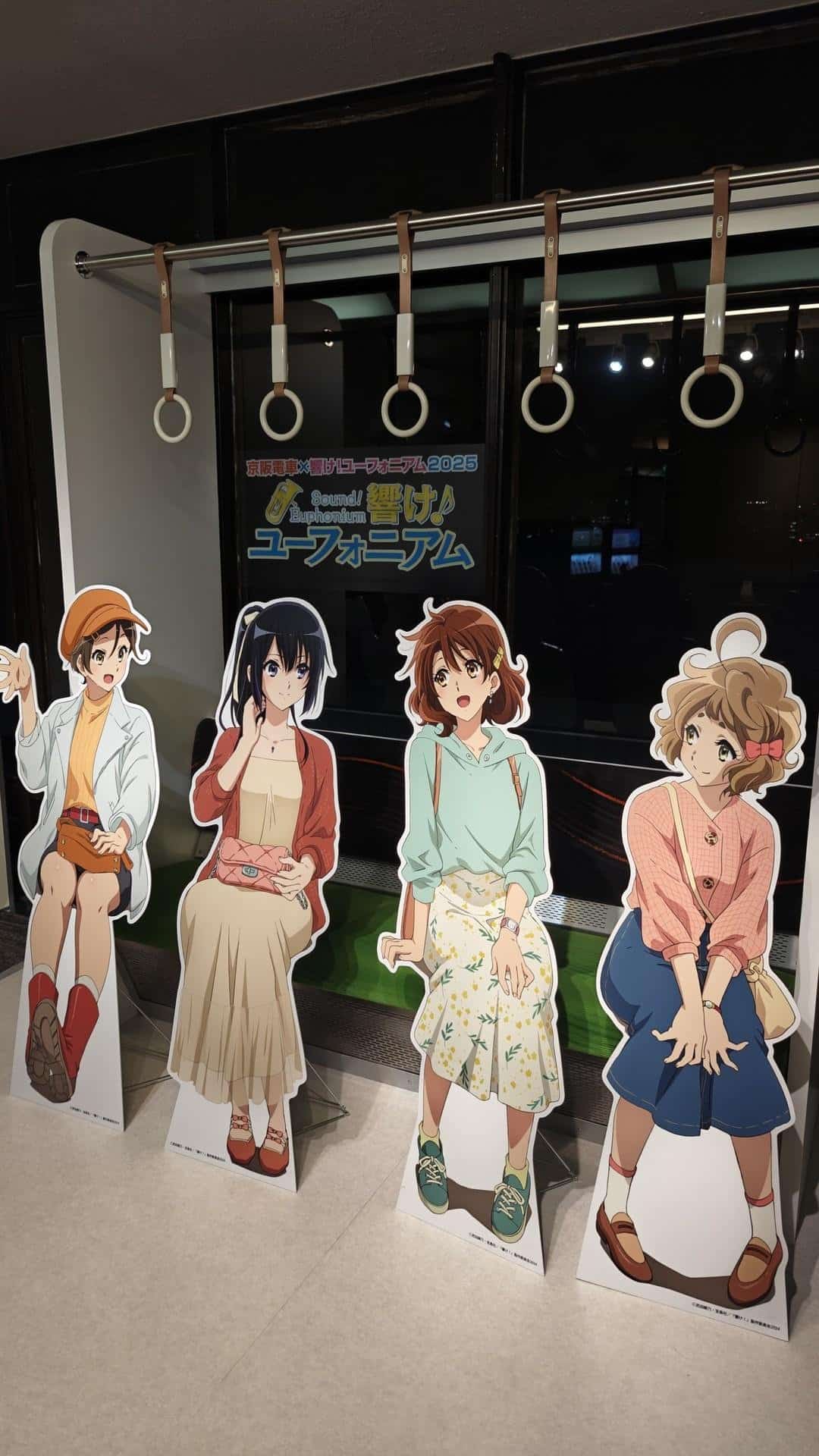 Anime cutouts in a train setting