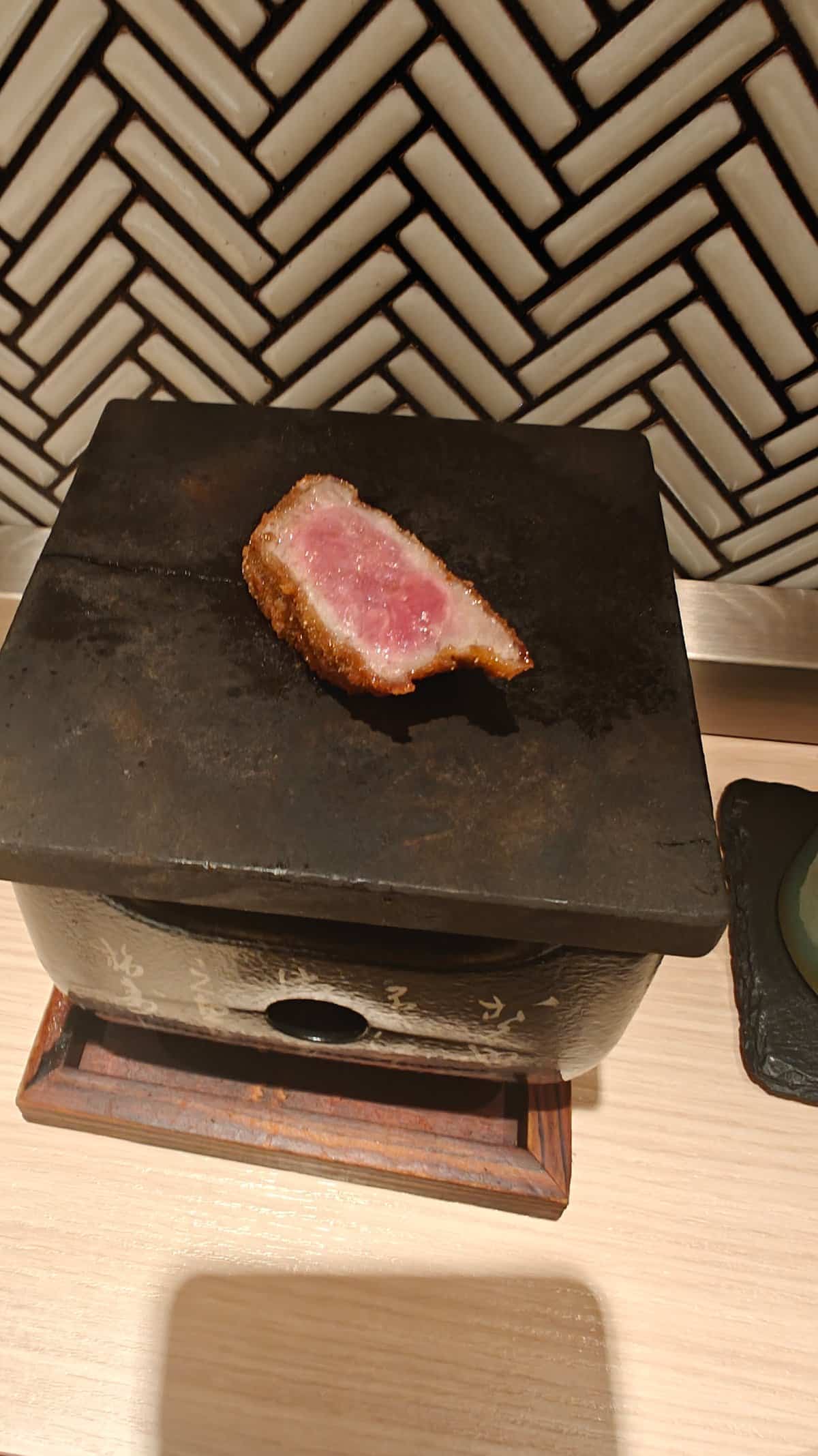 Beef slice cooking on ishiyaki