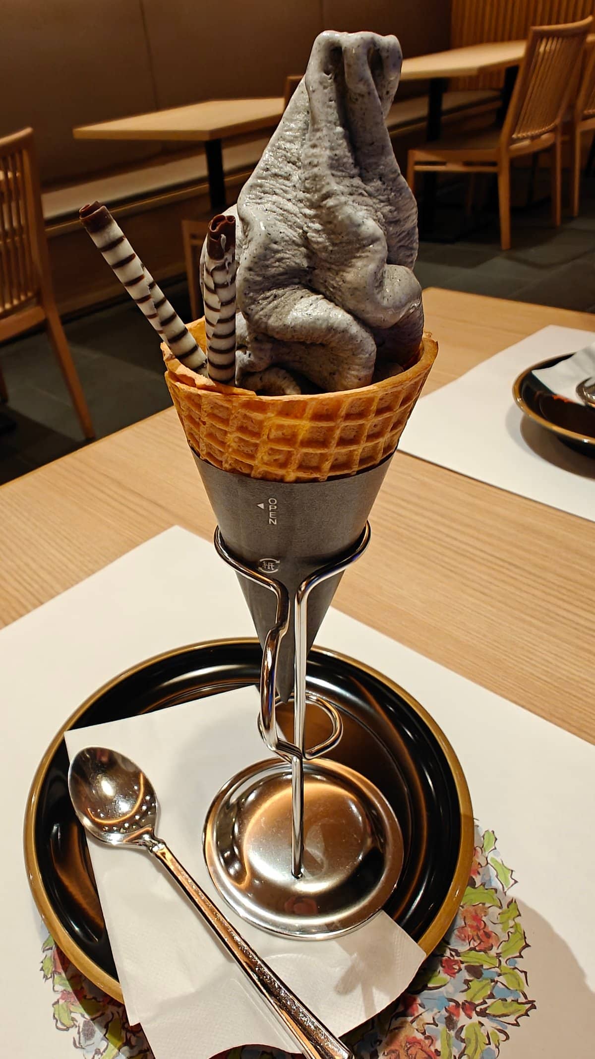 Black sesame parfait in waffle cone with striped