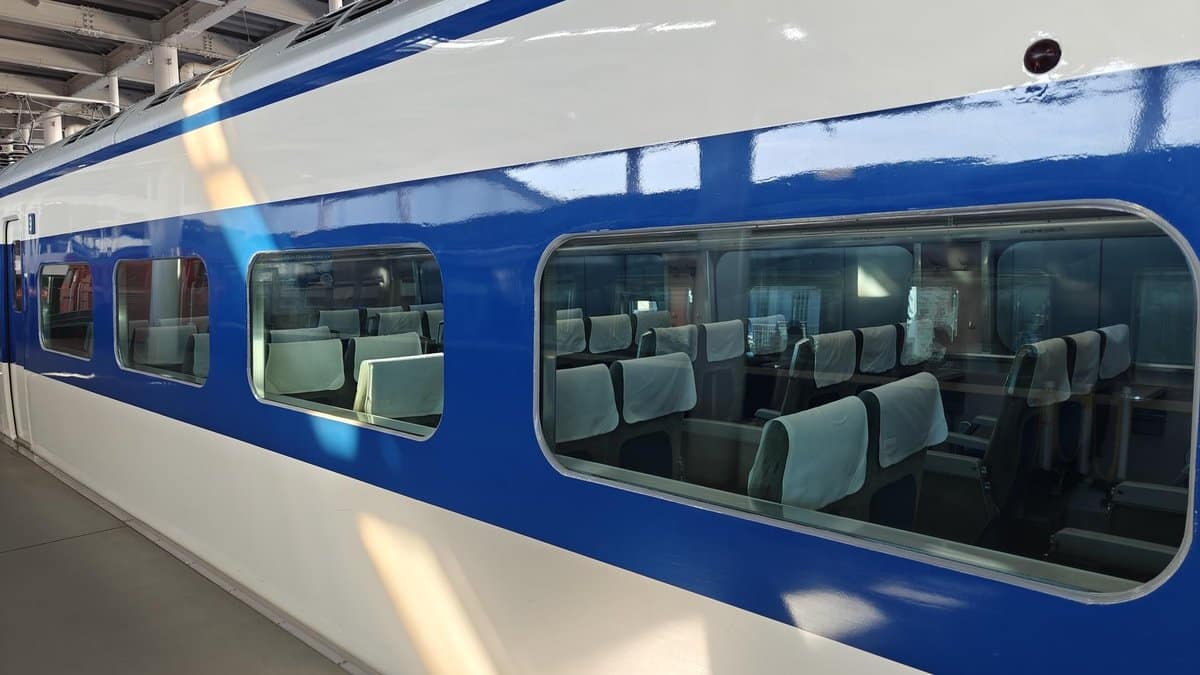 Blue and white train at station