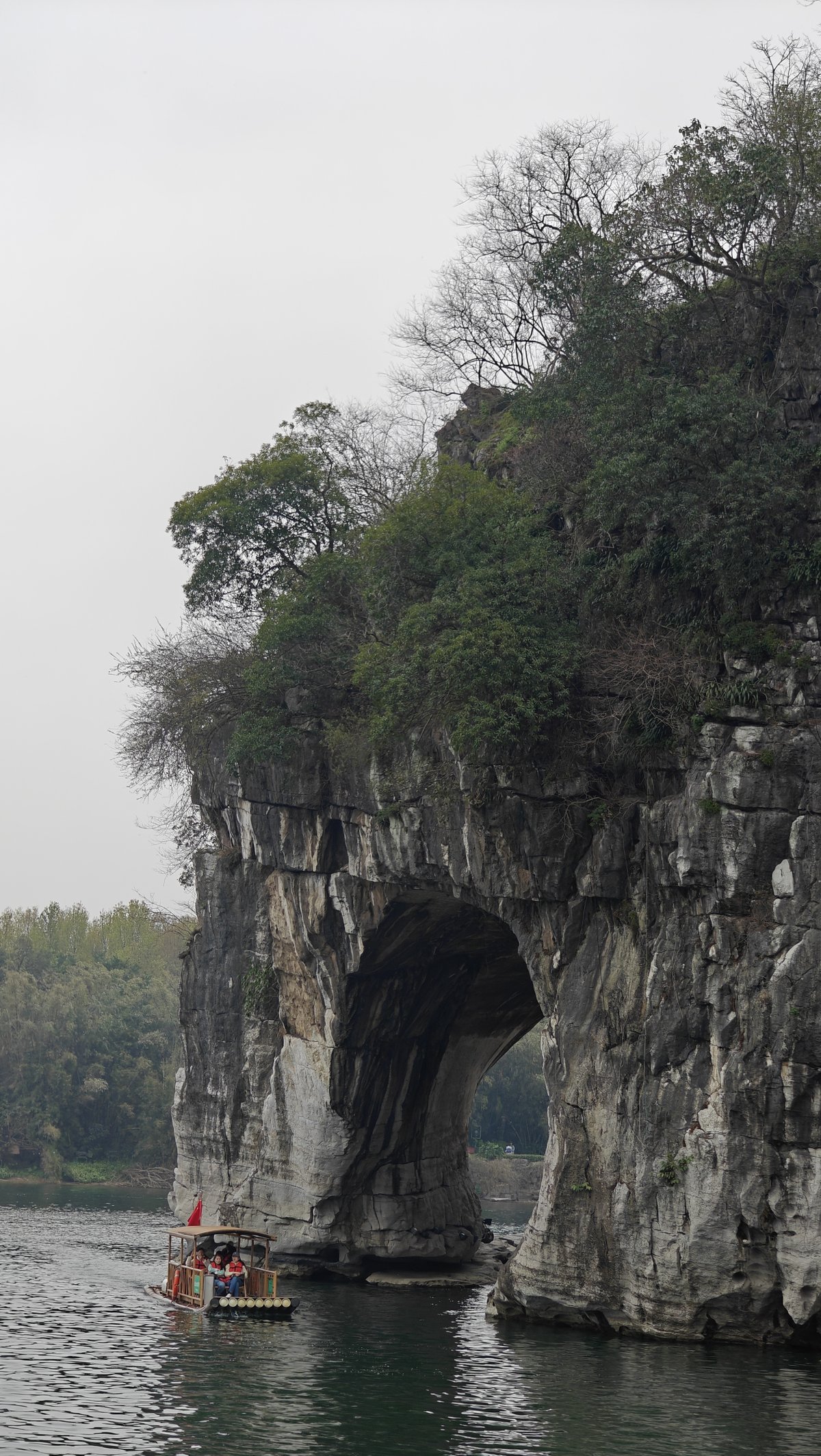 Boat passing under elephant arch