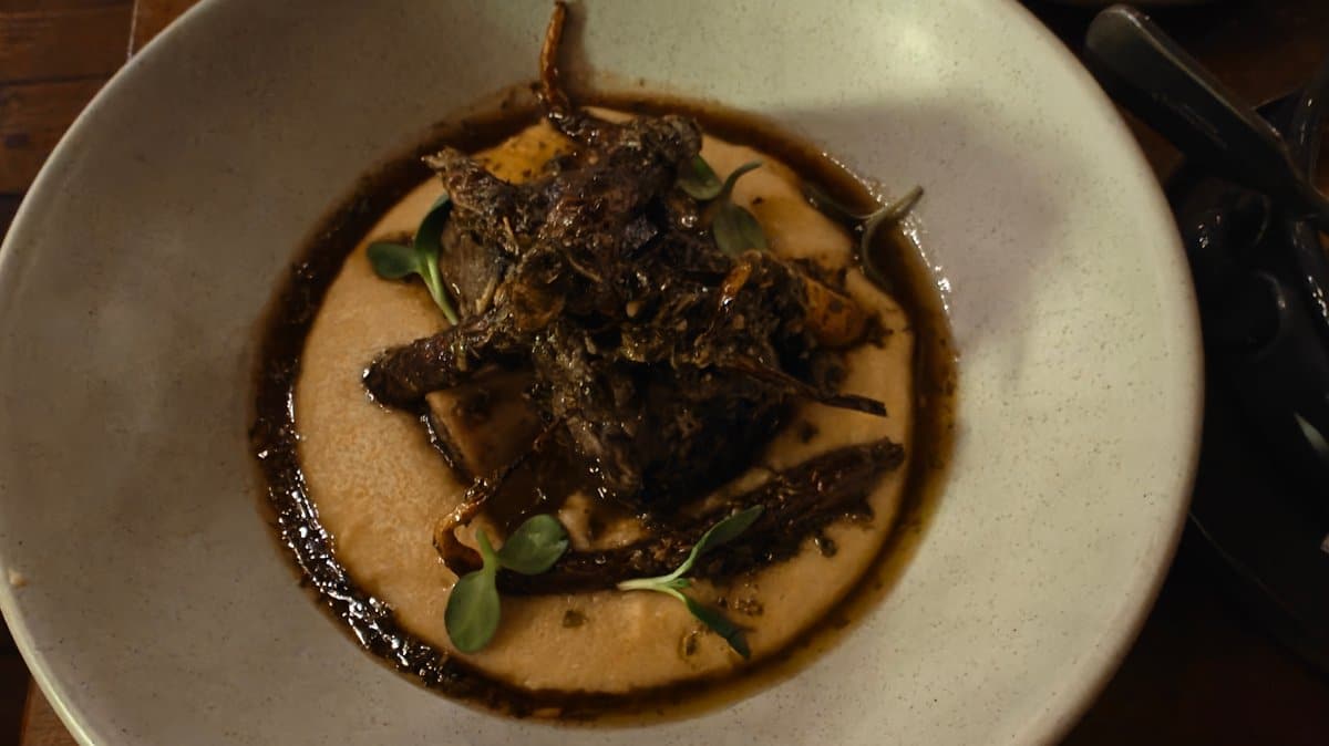 Braised meat on polenta