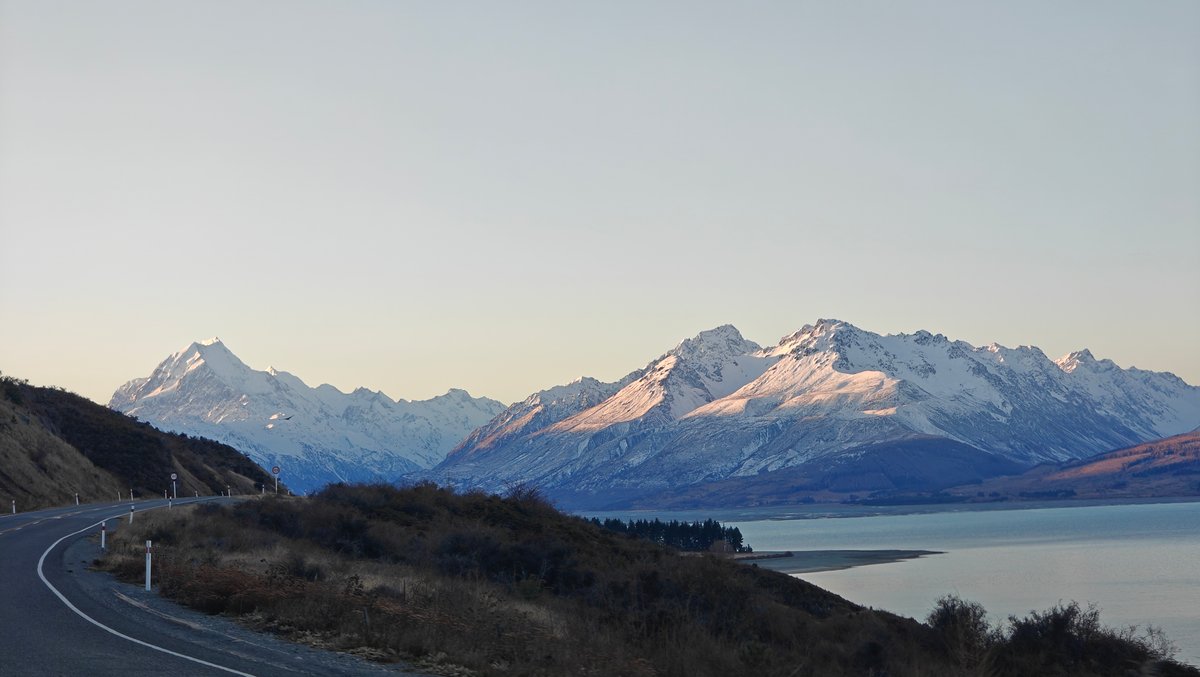 Broad view of snow mountains above a glacial