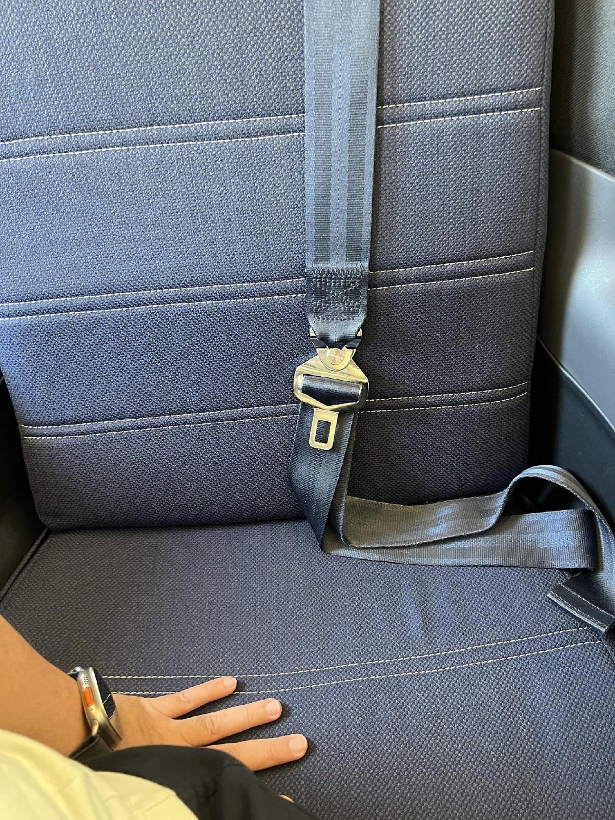 Car seat with visible seatbelt