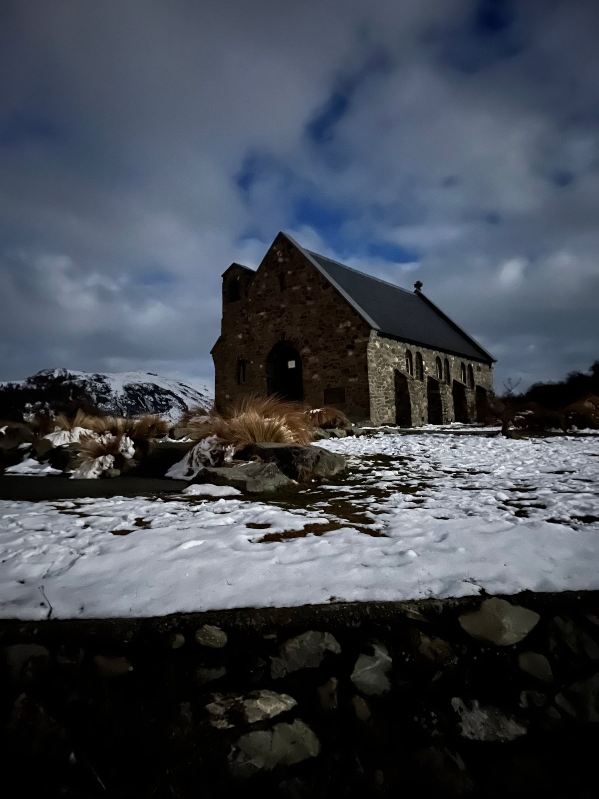 Church under dramatic snowy sky