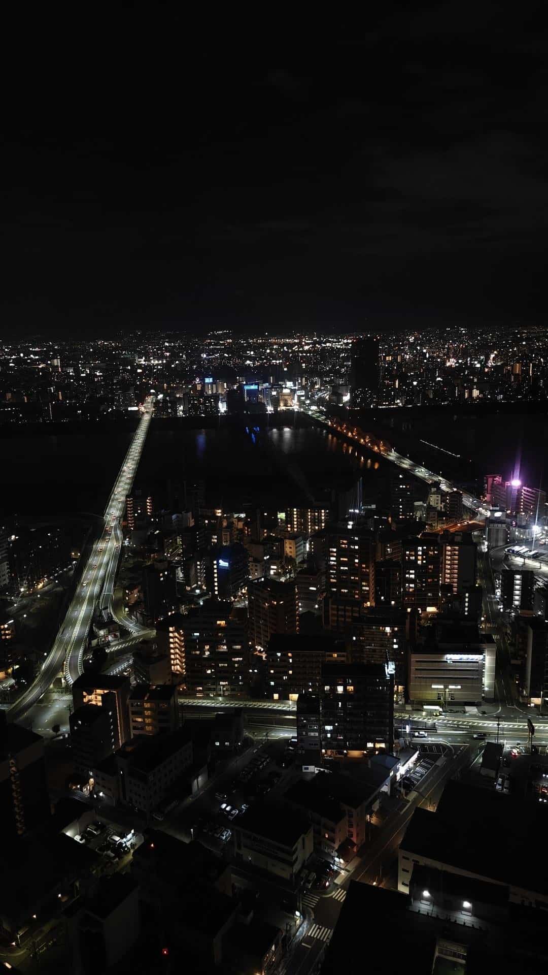 City skyline with illuminated roads at night