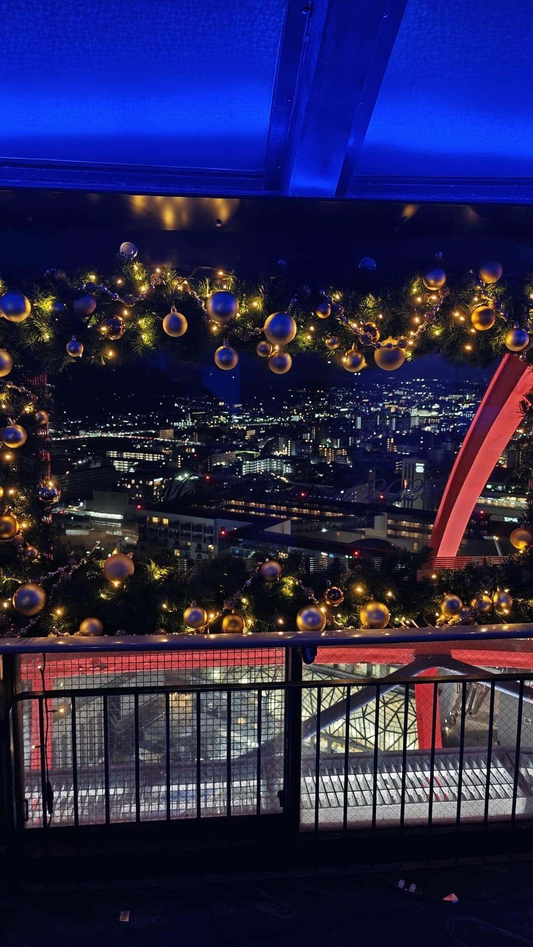 Cityscape framed by festive lights