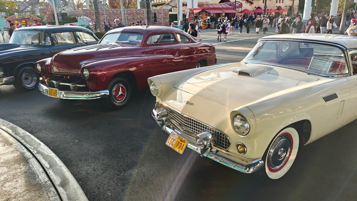 Classic vintage cars parked outside - red Mercury