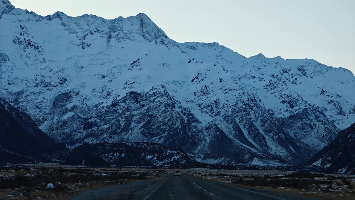 Close horizontal view of a broad snow-covered massif