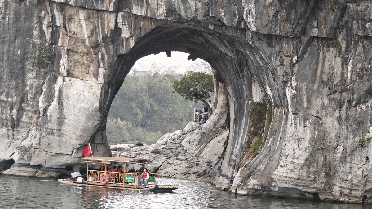 Close-up of the arch with boat passing through