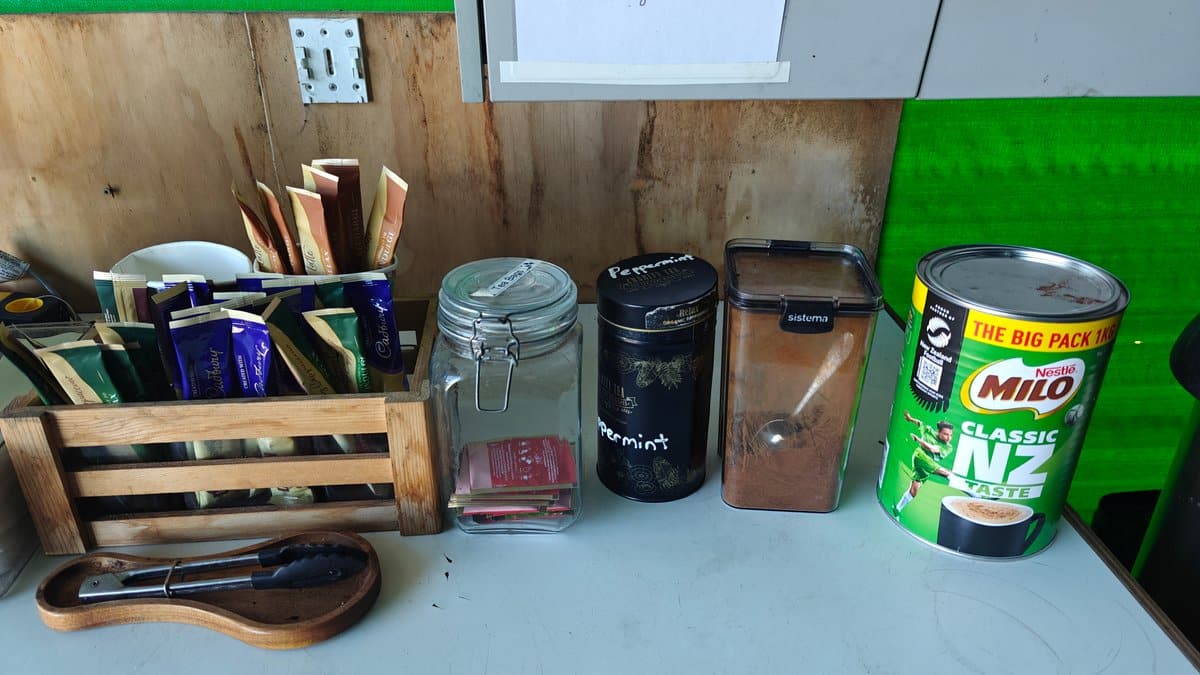 Close-up of the refreshments crate with brushes/stirrers and