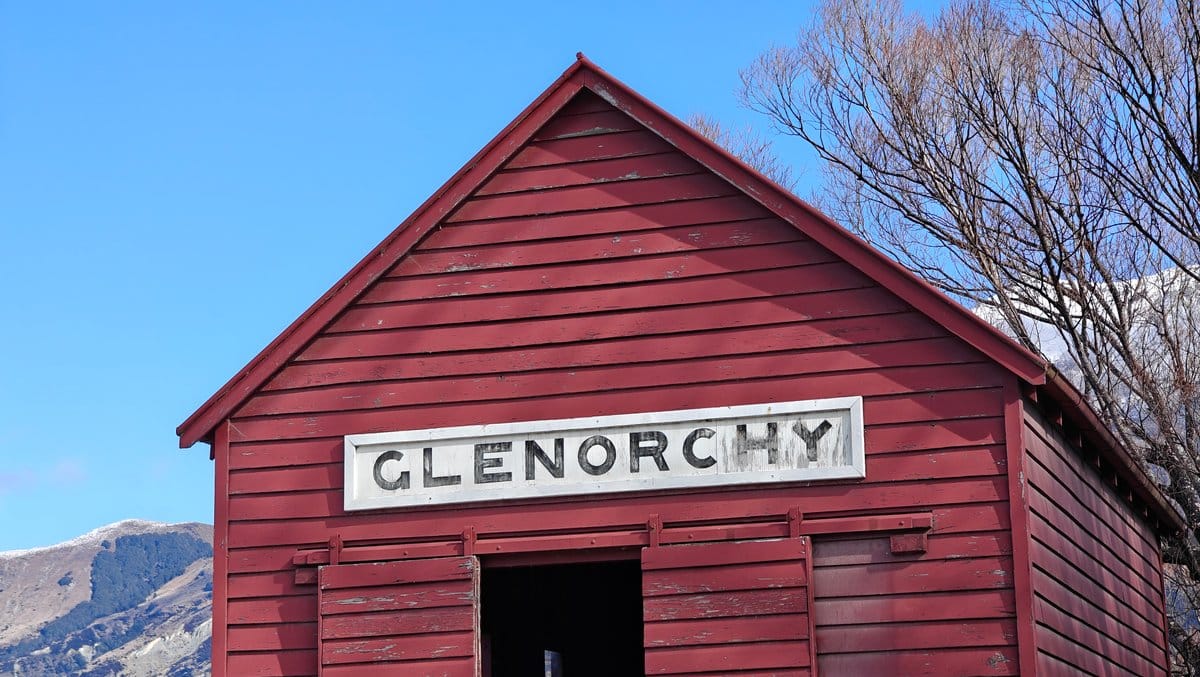 Close view of the red wharf shed's gabled