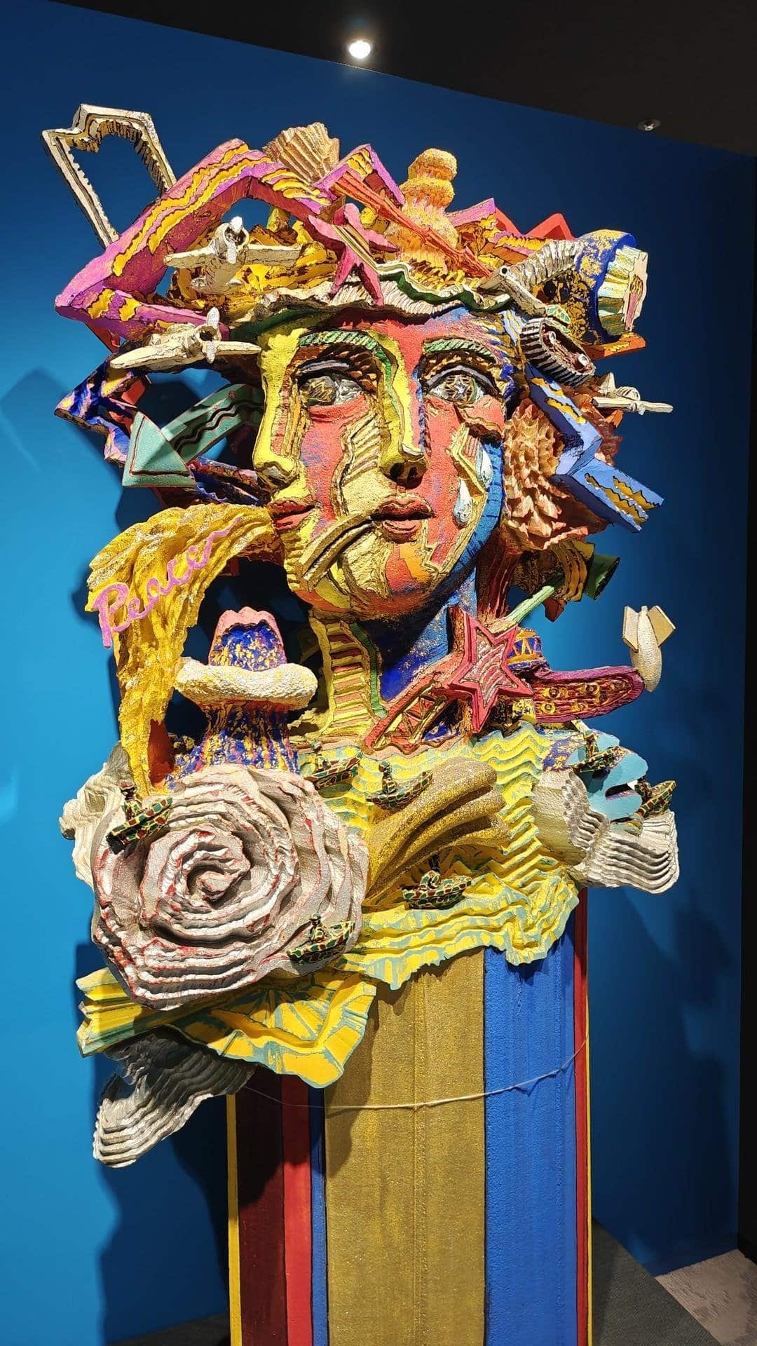 Colorful abstract sculpture on blue background