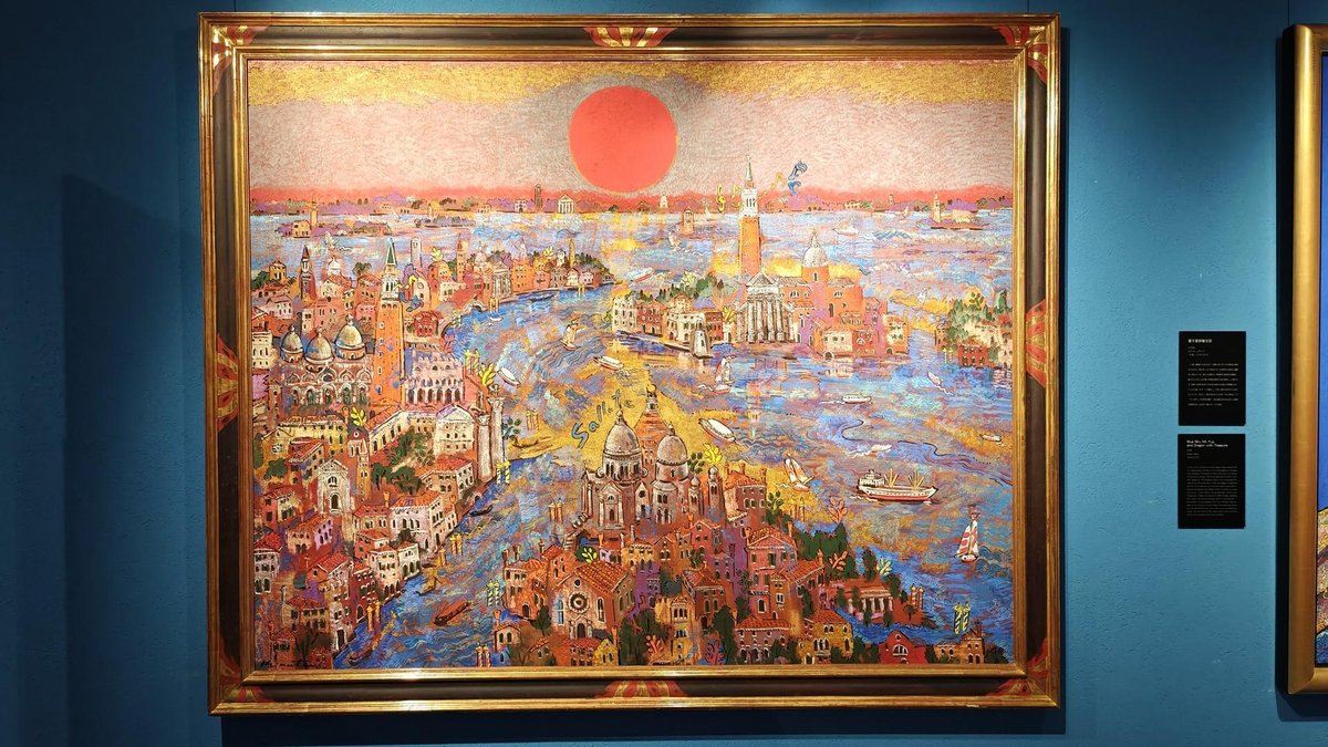 Colorful cityscape painting in gold frame
