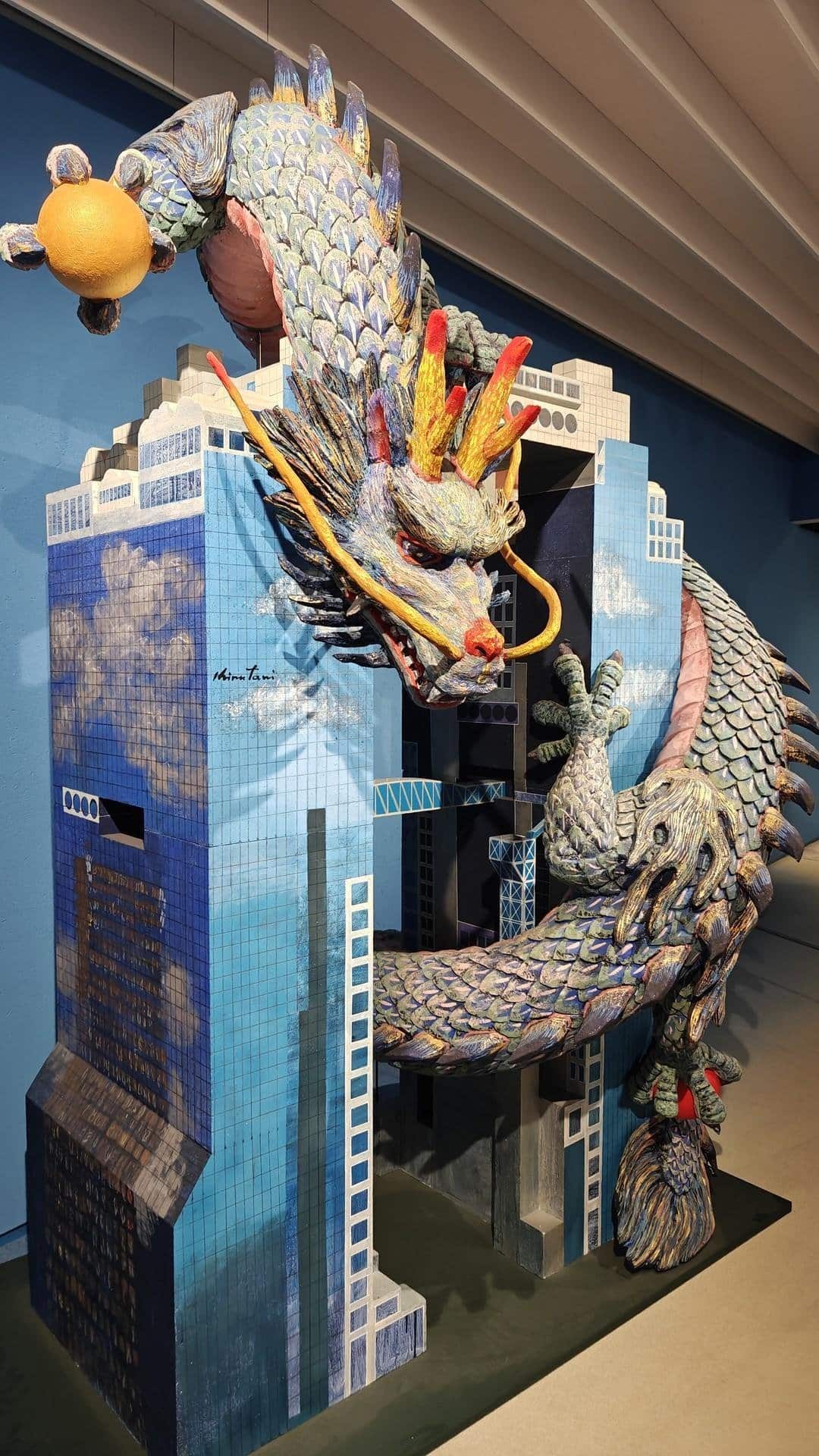 Colorful dragon sculpture on buildings