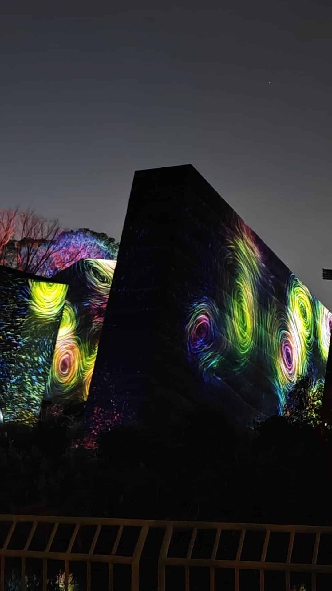 Colorful light patterns on building at night