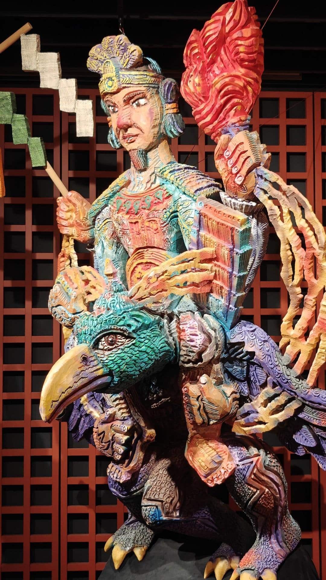 Colorful warrior statue on mythical bird