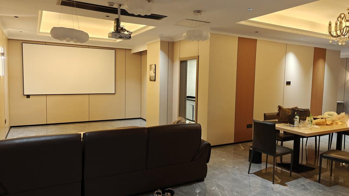 Common area with projection screen and modern seating