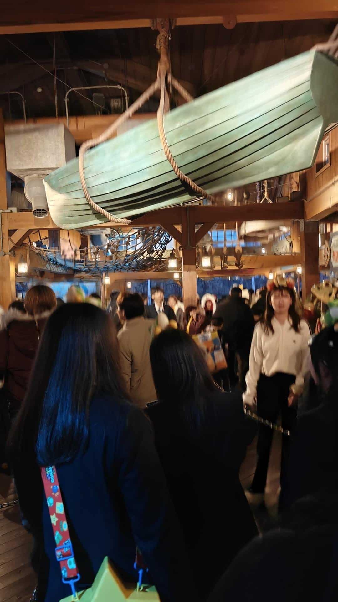 Crowded interior with hanging canoe