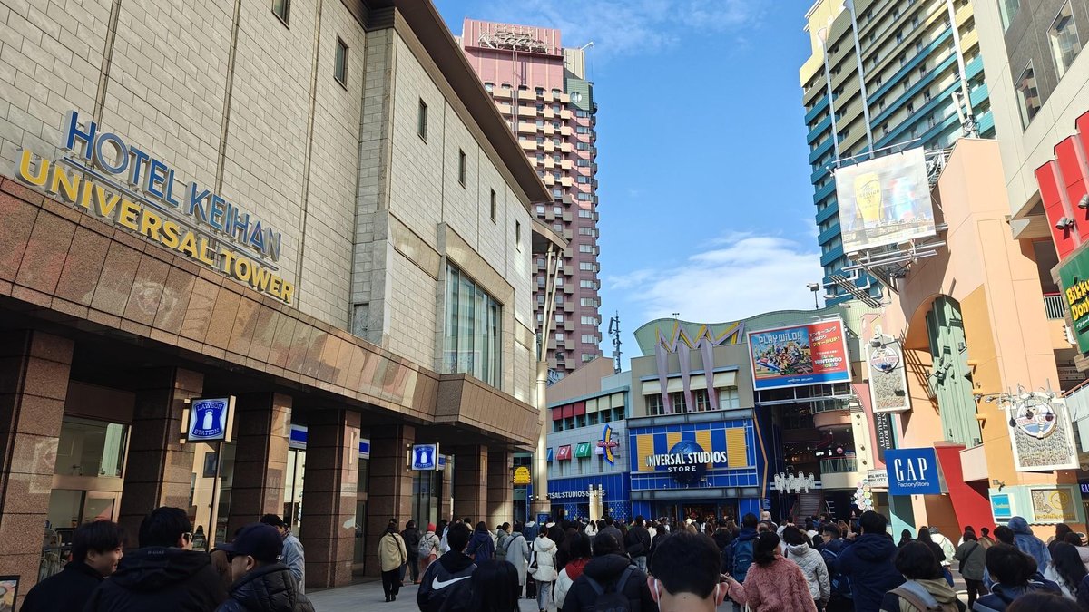 Crowded street near hotel and shops