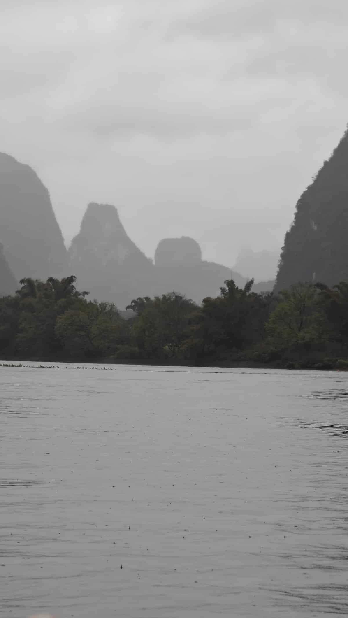 Distant peaks fading into grey mist