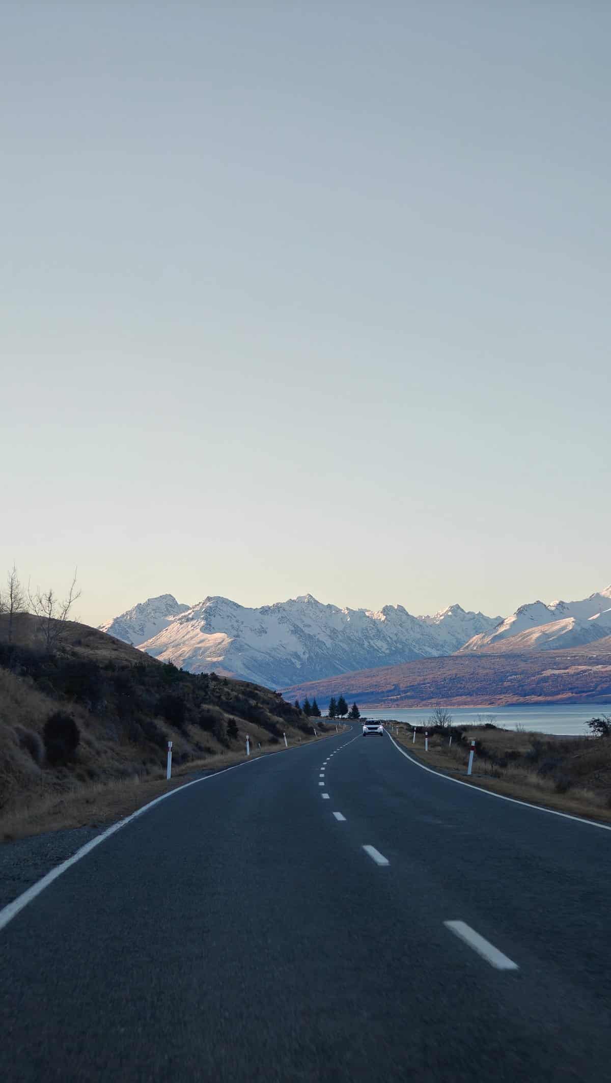 Driving toward snow peaks and lake