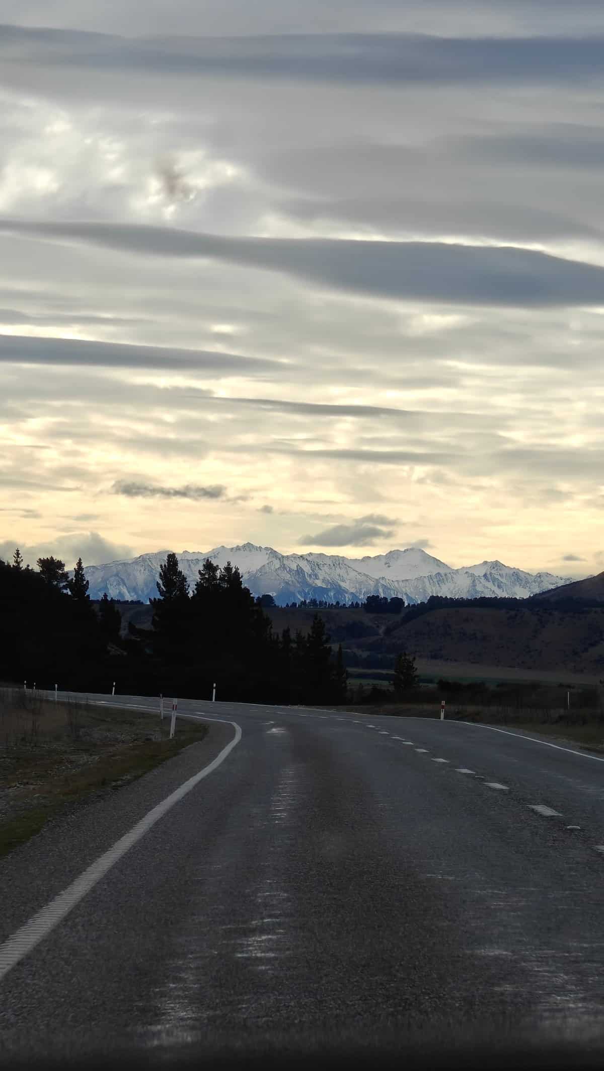 Evening highway to distant snow range