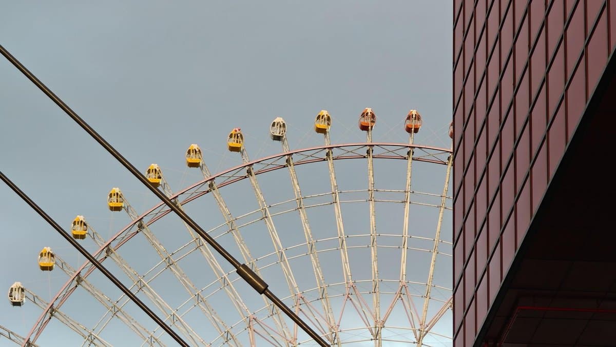 Ferris wheel against gray sky