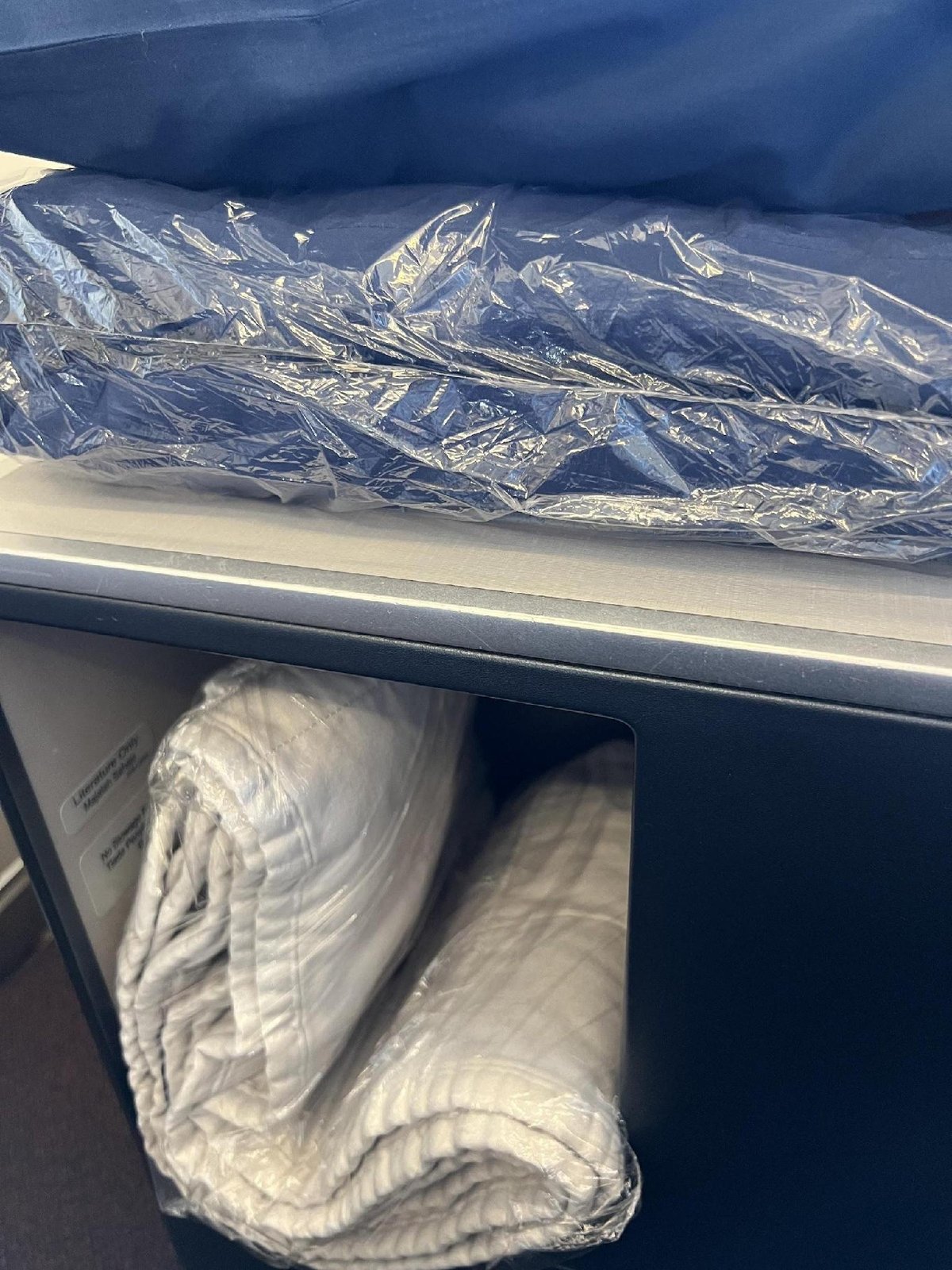 Folded blankets in plastic packaging
